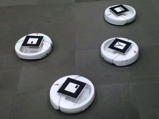 Photo of four iRobot Create differential-drive robots