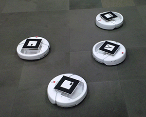 Photo of four iRobot Create differential-drive robots